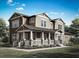 Charming two-story home with inviting front porch, columns, and lush landscaping at 1878 Seawall Way, Celebration, FL 34747