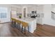 Modern kitchen featuring stainless appliances, granite counters, and bar stool seating at 1878 Seawall Way, Celebration, FL 34747
