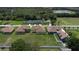 This aerial view shows a neighborhood with beautiful homes and manicured lawns near a serene lake at 1919 Sipes Ave, Sanford, FL 32771