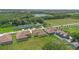 This aerial captures well-maintained homes, lush trees, and a serene lake in the distance at 1919 Sipes Ave, Sanford, FL 32771