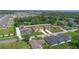 This aerial view captures a suburban neighborhood featuring well-maintained homes, trees, and green lawns at 1919 Sipes Ave, Sanford, FL 32771