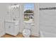 Bathroom featuring white walls, a soaking tub, and single sink at 1919 Sipes Ave, Sanford, FL 32771