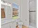The bathroom includes a single sink vanity and a tiled shower at 1919 Sipes Ave, Sanford, FL 32771