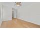 A ceiling fan hangs over this bedroom with light colored floors at 1919 Sipes Ave, Sanford, FL 32771