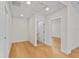 Bright bedroom with light hardwood floors and white trim throughout the house at 1919 Sipes Ave, Sanford, FL 32771