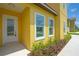 Inviting front entrance featuring a decorative glass door and manicured landscaping at 1919 Sipes Ave, Sanford, FL 32771