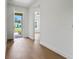 Bright entryway with hardwood floors leading to an open-concept living space at 1919 Sipes Ave, Sanford, FL 32771