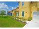 Well-maintained home exterior with a manicured lawn and landscaped pathway at 1919 Sipes Ave, Sanford, FL 32771