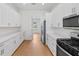 Well-lit kitchen with abundant white cabinets and stainless steel appliances at 1919 Sipes Ave, Sanford, FL 32771
