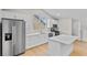 Modern kitchen featuring white cabinets and countertops with stainless steel appliances at 1919 Sipes Ave, Sanford, FL 32771