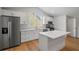 Modern kitchen featuring white cabinets, stainless steel appliances, and a center island at 1919 Sipes Ave, Sanford, FL 32771