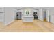 Modern kitchen featuring white cabinets, stainless steel appliances, and a central island at 1919 Sipes Ave, Sanford, FL 32771
