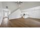 Open-concept living space with hardwood floors and a view of the modern kitchen at 1919 Sipes Ave, Sanford, FL 32771