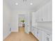View of the white pantry that leads to the kitchen at 1919 Sipes Ave, Sanford, FL 32771