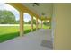 Long, covered patio with ceiling fans, offering a great view of the backyard at 1919 Sipes Ave, Sanford, FL 32771