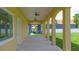 Extended patio with ceiling fans and arched supports overlooking the expansive backyard at 1919 Sipes Ave, Sanford, FL 32771