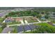 Aerial view of new homes and neighborhood street in a well-planned community with mature trees at 1929 Sipes Ave, Sanford, FL 32771