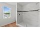 Modern bathroom featuring neutral colors and updated shower and window at 1929 Sipes Ave, Sanford, FL 32771
