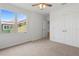 Bedroom with a big window, closet, neutral carpet and white walls at 1929 Sipes Ave, Sanford, FL 32771