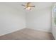 This bedroom has neutral carpet, ceiling fan and one window at 1929 Sipes Ave, Sanford, FL 32771