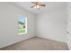 A bedroom with carpet, one window, a ceiling fan, and a closet at 1929 Sipes Ave, Sanford, FL 32771
