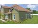 Side view of a well-maintained two-story home with lush greenery at 1929 Sipes Ave, Sanford, FL 32771
