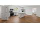 Kitchen featuring stainless steel appliances, island, and hardwood floors at 1929 Sipes Ave, Sanford, FL 32771
