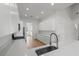 Contemporary kitchen with abundant white cabinetry and stainless steel appliances at 1929 Sipes Ave, Sanford, FL 32771