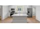 Modern kitchen with stainless steel appliances, white cabinets, and center island at 1929 Sipes Ave, Sanford, FL 32771