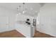 Modern kitchen with sleek white cabinetry, stainless steel appliances, and a breakfast bar at 1929 Sipes Ave, Sanford, FL 32771