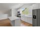 Modern kitchen with stainless appliances, island, and window at 1929 Sipes Ave, Sanford, FL 32771
