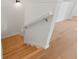 Bright staircase featuring hardwood steps, white walls, and a traditional handrail for a classic touch at 1929 Sipes Ave, Sanford, FL 32771