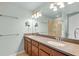 Bathroom featuring dual sinks and glass door shower at 2058 Prospect Ave, Orlando, FL 32814