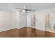 Comfortable bedroom with hardwood floors, ceiling fan, closet and ensuite bathroom with tiled shower at 2058 Prospect Ave, Orlando, FL 32814