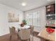 Charming breakfast nook with marble table, plush chairs, and natural light at 2058 Prospect Ave, Orlando, FL 32814