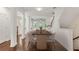 Open-concept dining area with wood floors and a modern dining table and chairs at 2058 Prospect Ave, Orlando, FL 32814