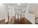 Bright entryway featuring hardwood floors, white trim, and an open floor plan to the living area and staircase at 2058 Prospect Ave, Orlando, FL 32814