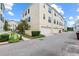 Exterior facade of a multi-story building with a street view and three garage doors at 2058 Prospect Ave, Orlando, FL 32814