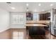 Contemporary kitchen features a center island, dark wood cabinets, stainless steel appliances, and granite countertops at 2058 Prospect Ave, Orlando, FL 32814