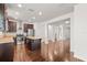 Open kitchen concept showcasing dark wood cabinets, a center island, and stainless steel appliances, connected to the living space at 2058 Prospect Ave, Orlando, FL 32814