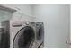 Laundry room featuring a side-by-side washer and dryer set and wire shelving at 2058 Prospect Ave, Orlando, FL 32814