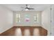 Open living area with hardwood floors, neutral walls, and access to the backyard at 2058 Prospect Ave, Orlando, FL 32814