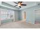 Spacious main bedroom featuring a ceiling fan and natural light at 2058 Prospect Ave, Orlando, FL 32814