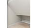 Compact under-stair storage area with finished walls and tile flooring at 2058 Prospect Ave, Orlando, FL 32814