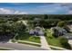 Aerial view of a home surrounded by lush trees at 2237 Wintermere Pointe Dr, Winter Garden, FL 34787