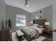 Stylish bedroom with a vaulted ceiling, carpet, and neutral tones is a relaxing retreat at 2237 Wintermere Pointe Dr, Winter Garden, FL 34787