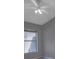 Cozy bedroom featuring a ceiling fan, window with blinds, and neutral wall paint at 2237 Wintermere Pointe Dr, Winter Garden, FL 34787
