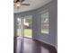 Bright bedroom with a ceiling fan, sliding glass doors, and hardwood floors at 2237 Wintermere Pointe Dr, Winter Garden, FL 34787