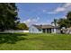 A well-maintained home with a spacious backyard and pristine lawn at 2237 Wintermere Pointe Dr, Winter Garden, FL 34787