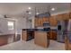 Open kitchen with an island, modern appliances, and a breakfast bar at 2237 Wintermere Pointe Dr, Winter Garden, FL 34787